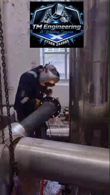 Tommy Drennan welding a flange in the workshop